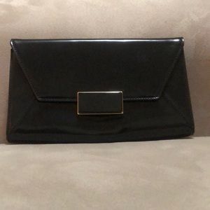Black clutch with cream interior. Used once.